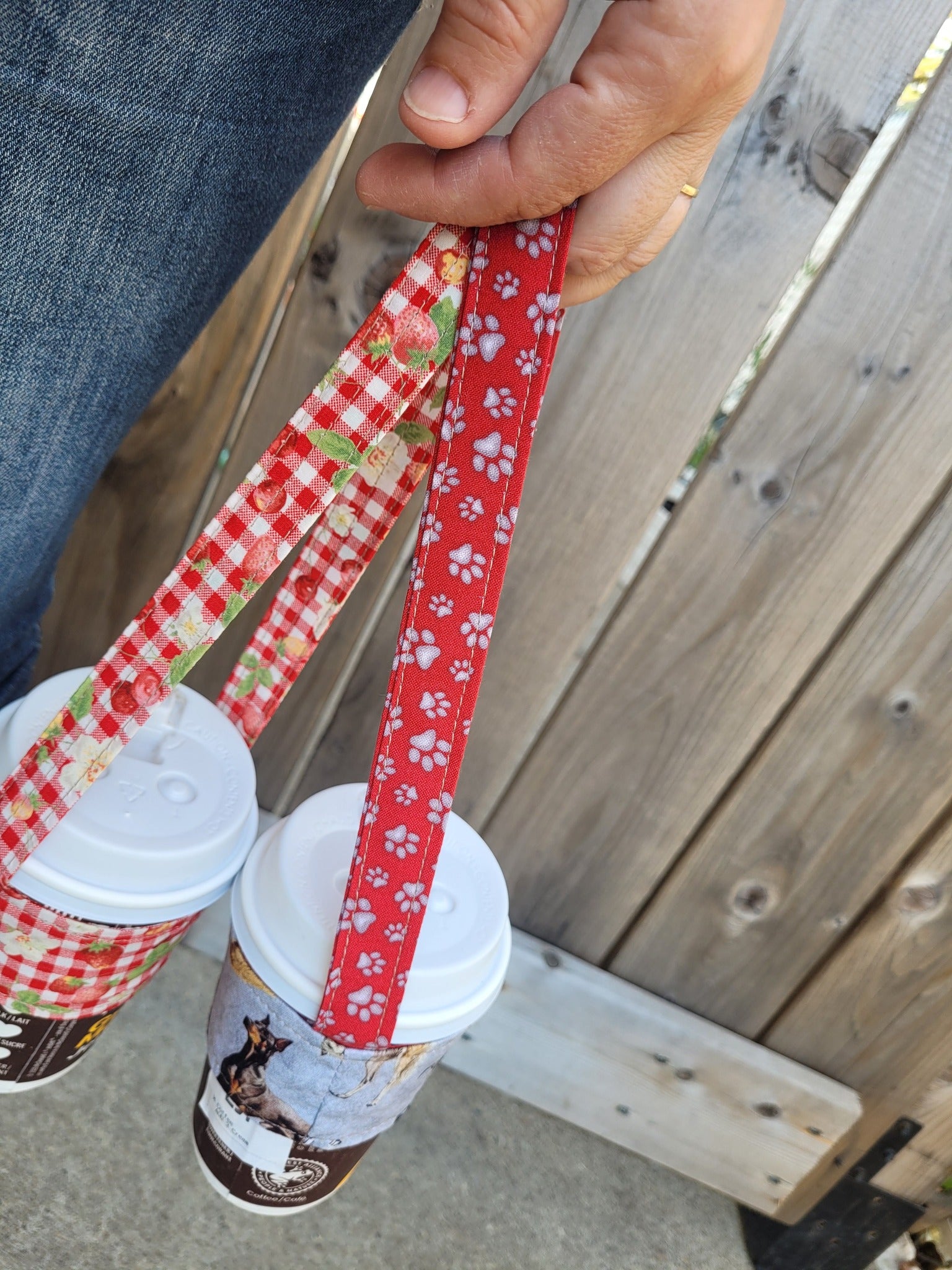 Floral and black coffee cup carrier.