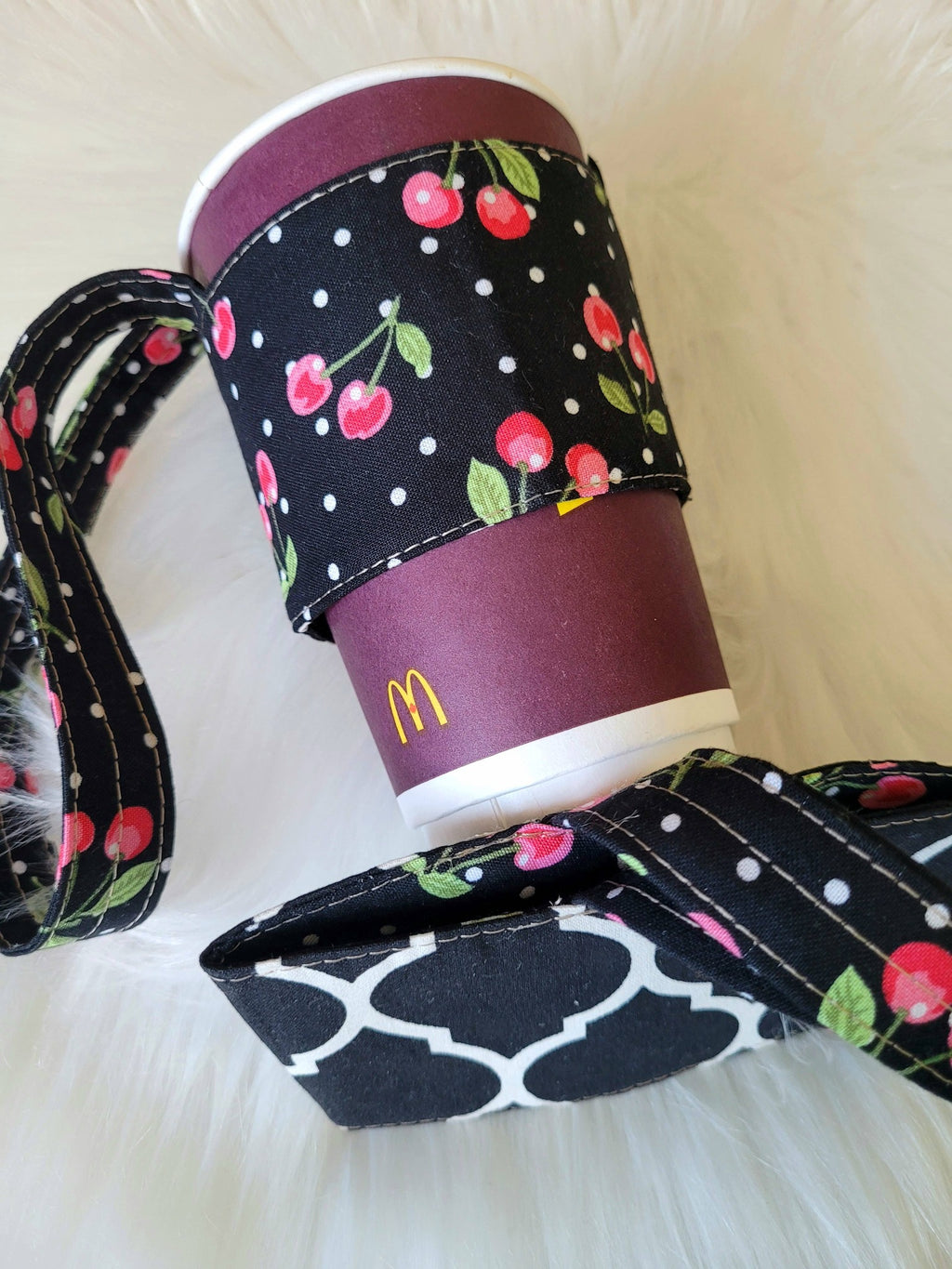 Cherry and black coffee cup carrier.