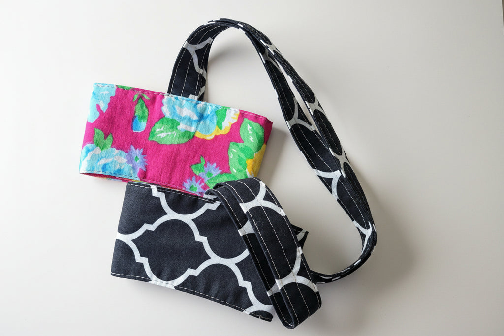 Floral and black coffee cup carrier.