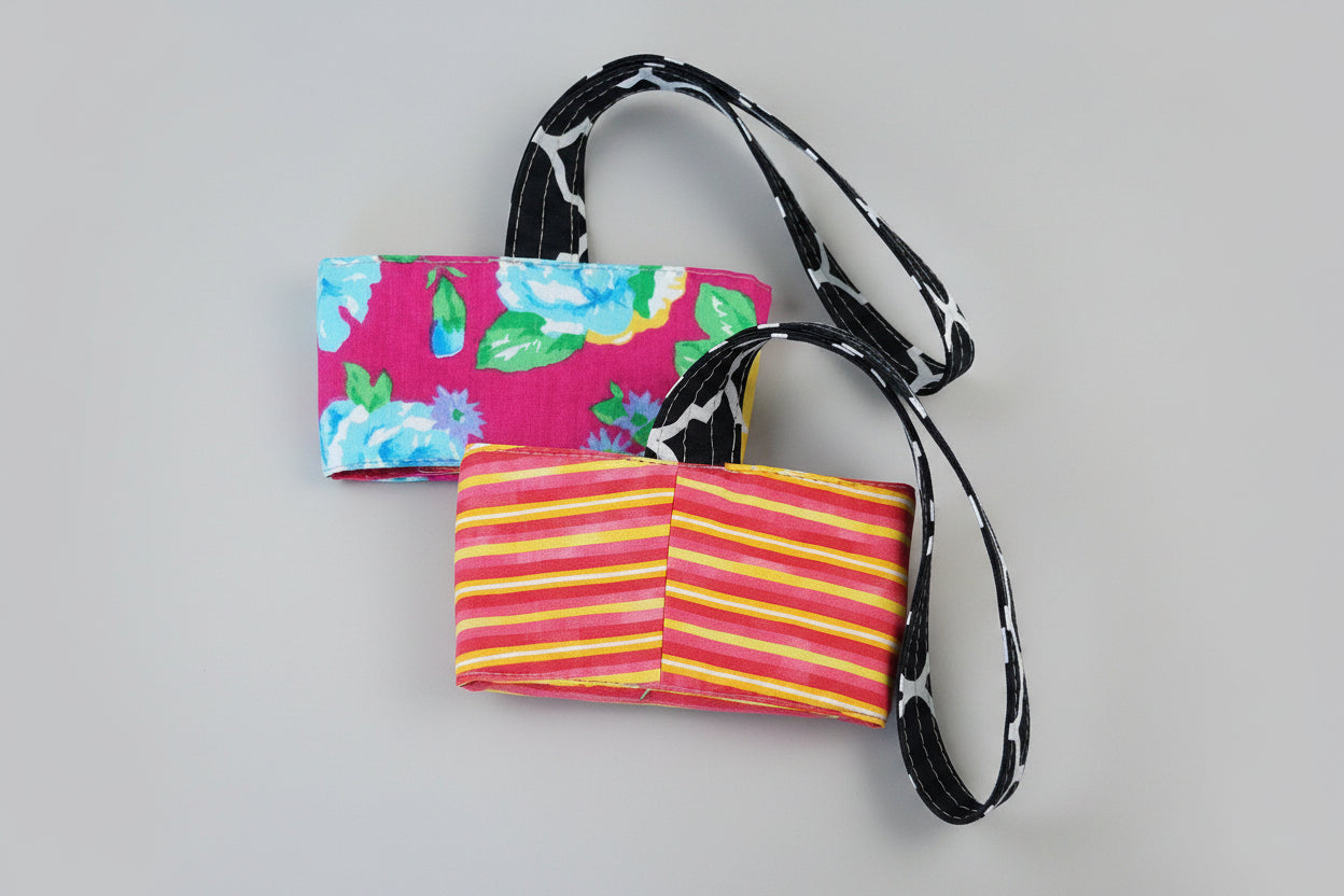 Floral and stripes coffee cup carrier.