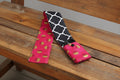Camera strap cover with lens cap pocket